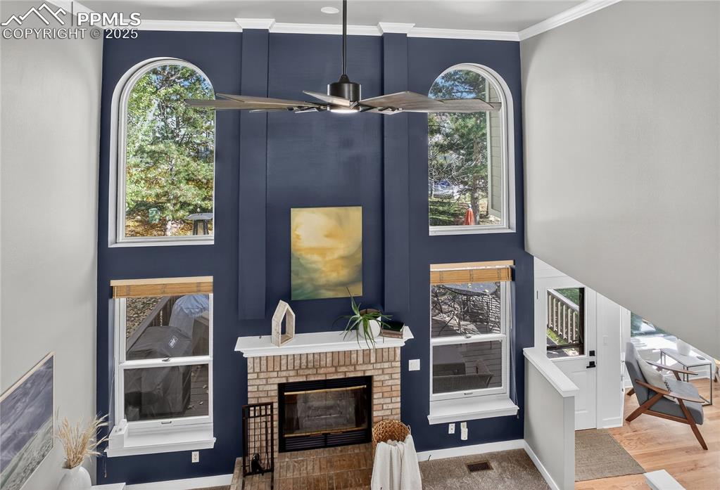 Image 23 of 47: Enjoy the views from the new Pella windows above the fireplace