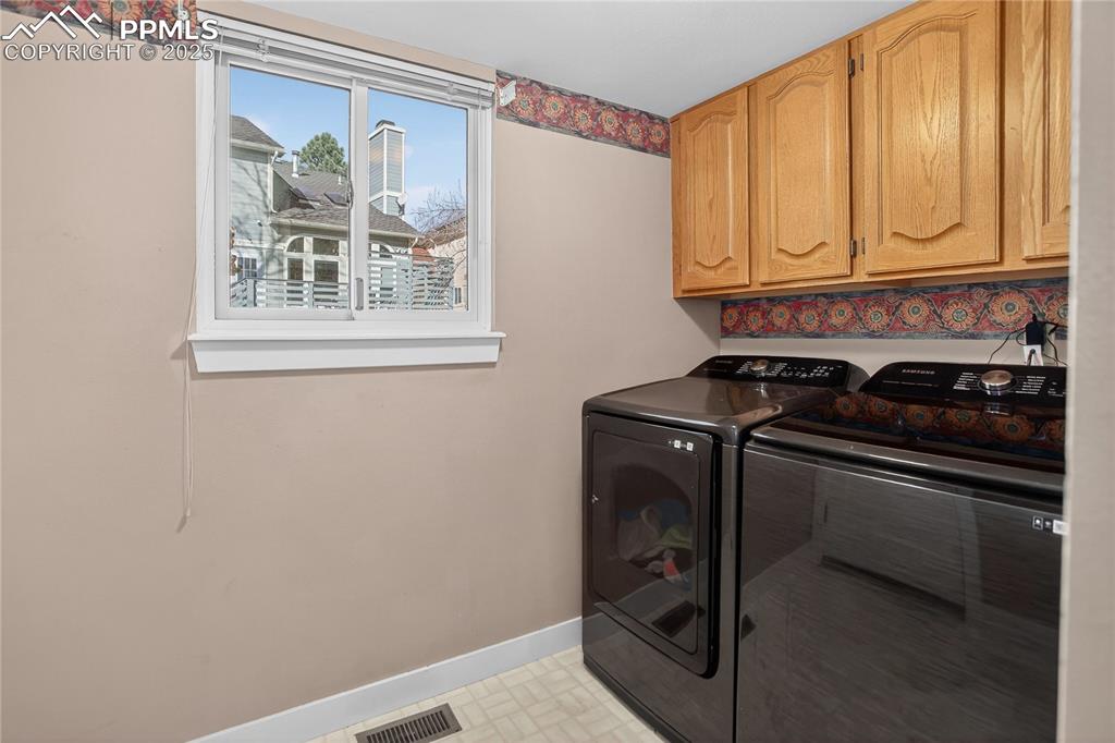 Image 25 of 47: Nice light with the window, Samsung washer & dryer 2024.