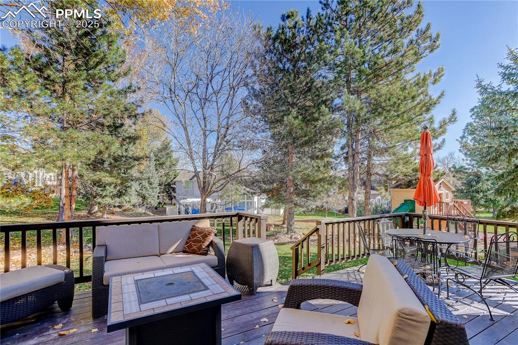 Image 42 of 47: Large deck has recent wood planks and plenty of room for a BBQ or evening c