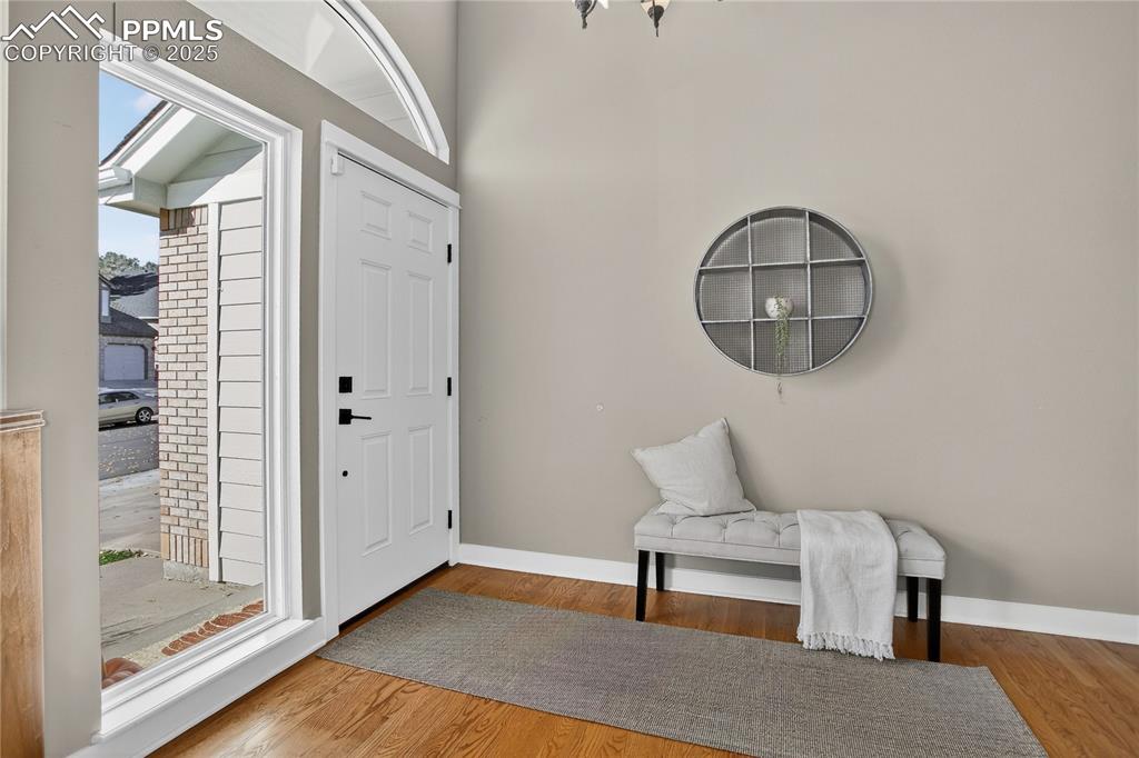 Image 6 of 47: Grand main-level Entry with soaring 17