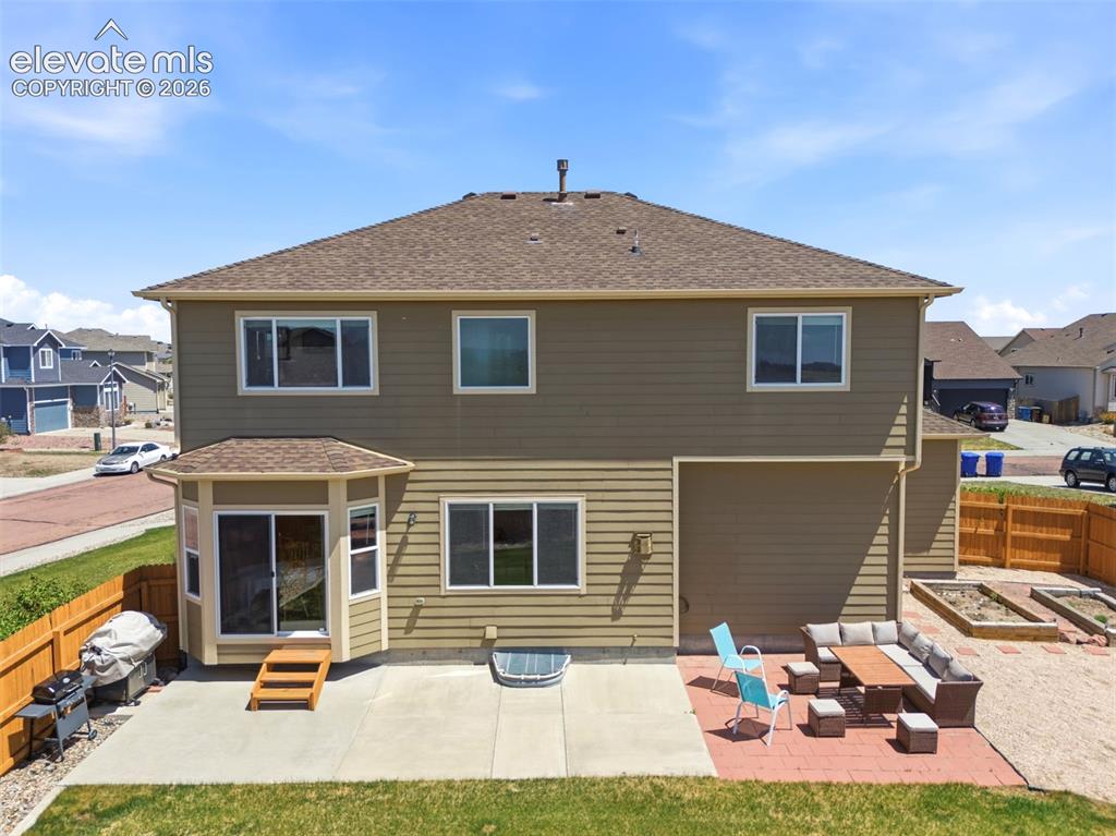 Image 32 of 33: Large Patio and Raised Garden Beds