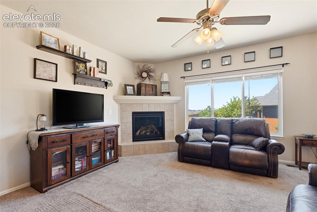 Image 8 of 33: Cozy Family Room with Gas Fireplace