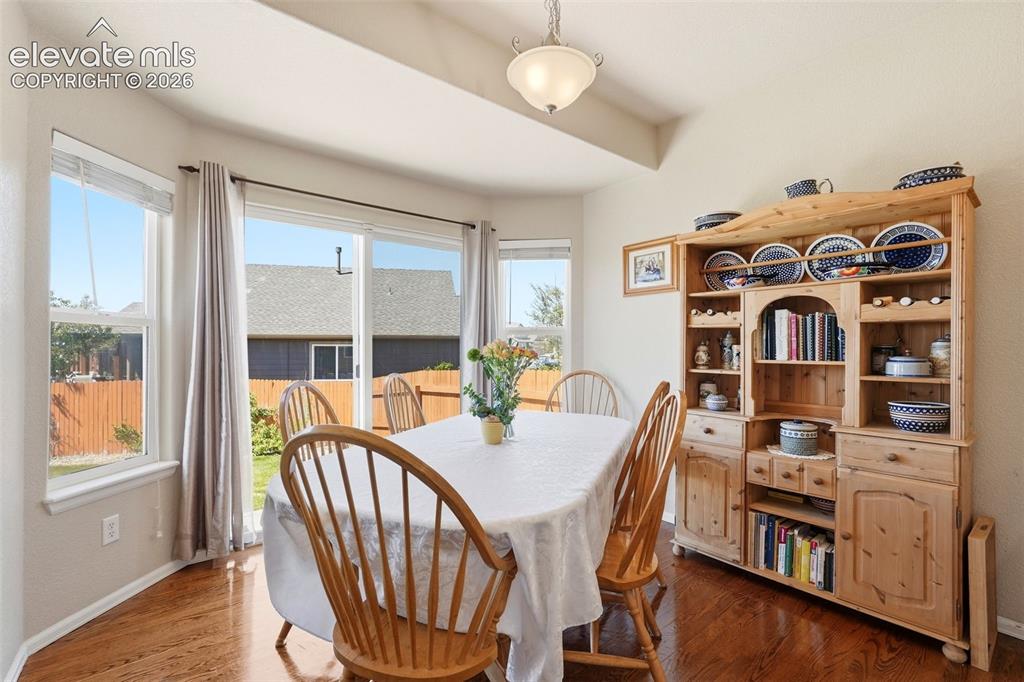 Image 9 of 33: Dining Area with Walkout to Back Yard