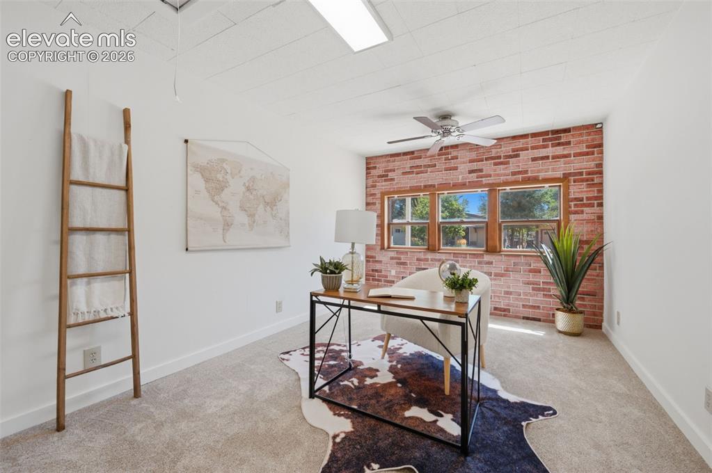 Image 18 of 34: Recessed ceiling light fixture, neutral carpet flooring, wood-frame windows