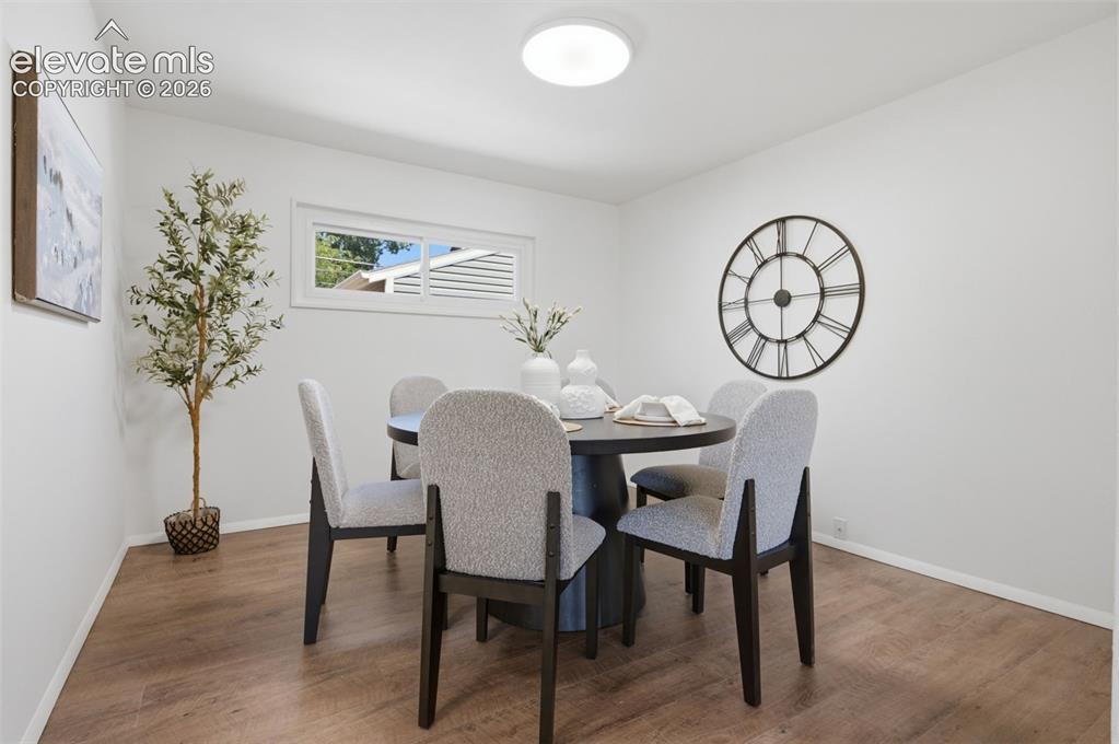 Image 8 of 34: Recessed window with white trim, wood-finish flooring, white walls, and a c