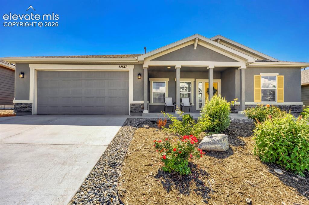 Image 2 of 45: Contemporary ranch-style exterior with a covered porch entry, and a three-c