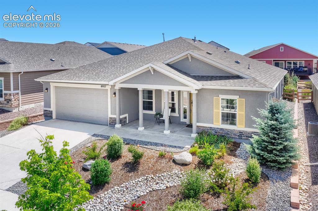 Image 5 of 45: Single-story residence featuring a covered front porch with columnar suppor