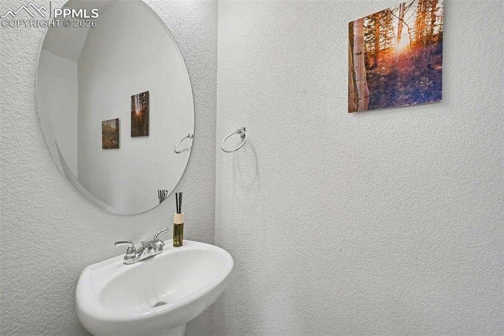 Image 16 of 29: main level powder room