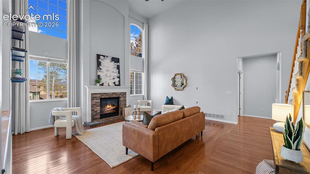 Image 10 of 43: Spacious living area featuring soaring ceilings and extensive natural light