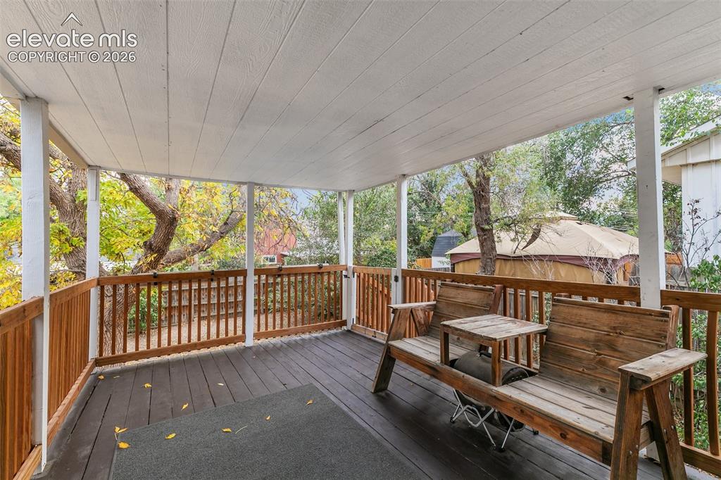 Image 19 of 39: Large, beautiful back covered deck