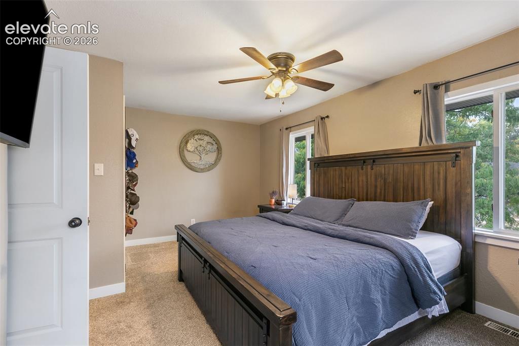 Image 20 of 39: Large primary bedroom with additional space to spready out, and 2 large clo