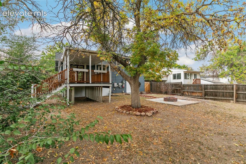 Image 36 of 39: Large treed backyard, ready for mountain town relaxing!