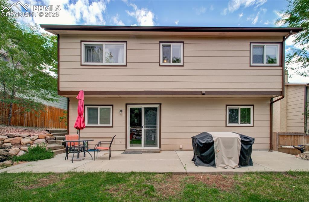 Image 22 of 25: Rear view of property with a patio area