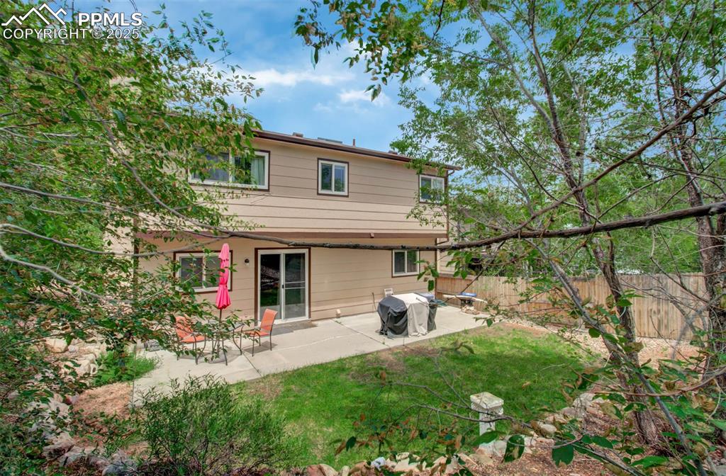 Image 23 of 25: Rear view of property featuring a patio