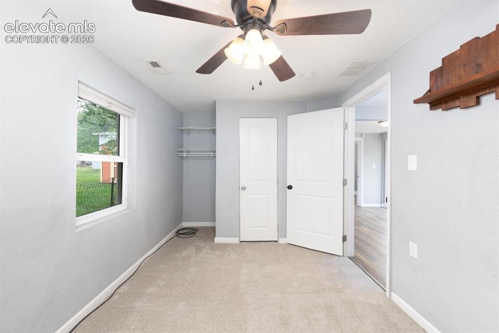Image 11 of 30: The second main level bedroom