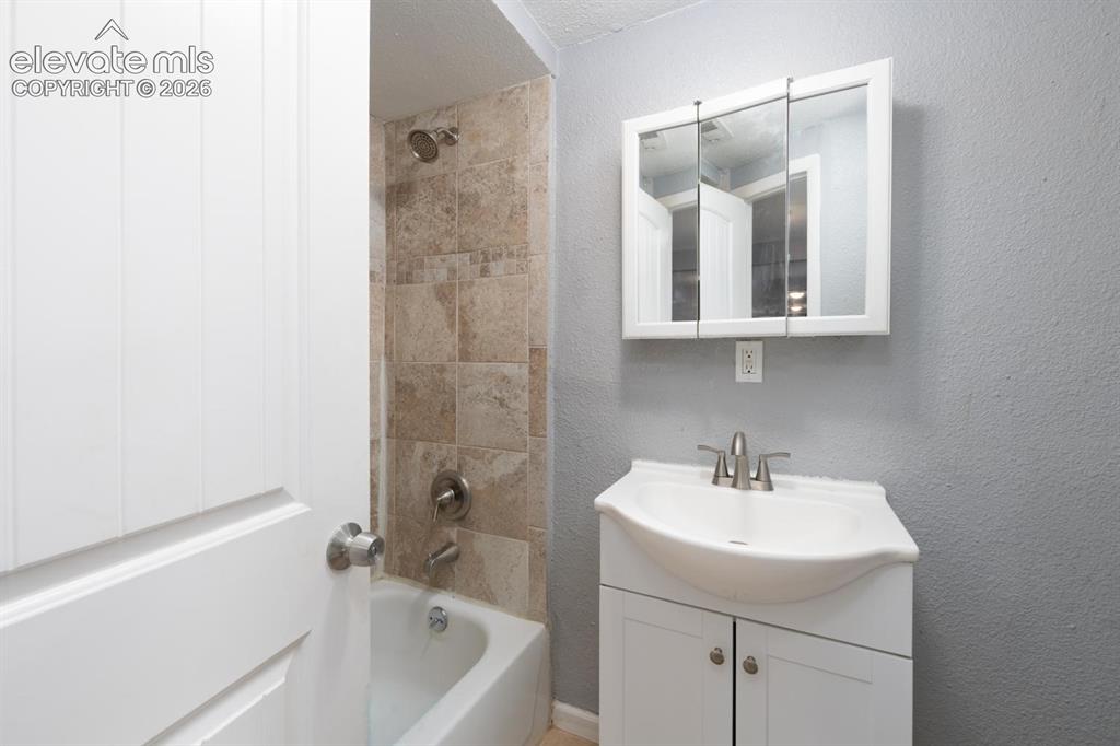 Image 15 of 30: Main level bathroom