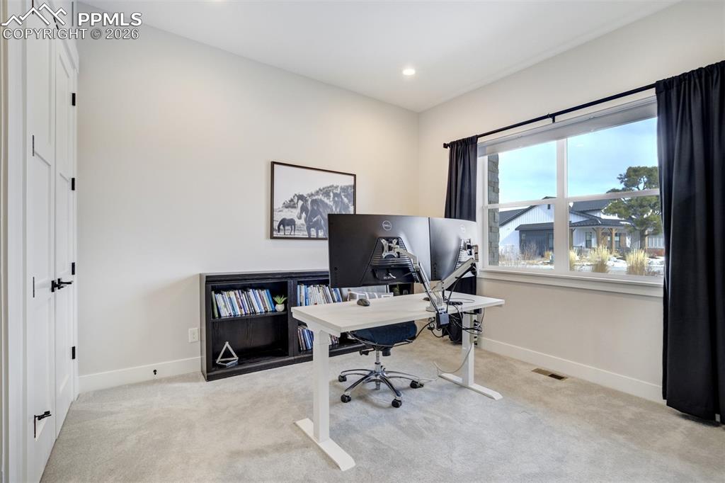 Image 22 of 50: Main level bedroom w/adjoining 3/4 bathroom