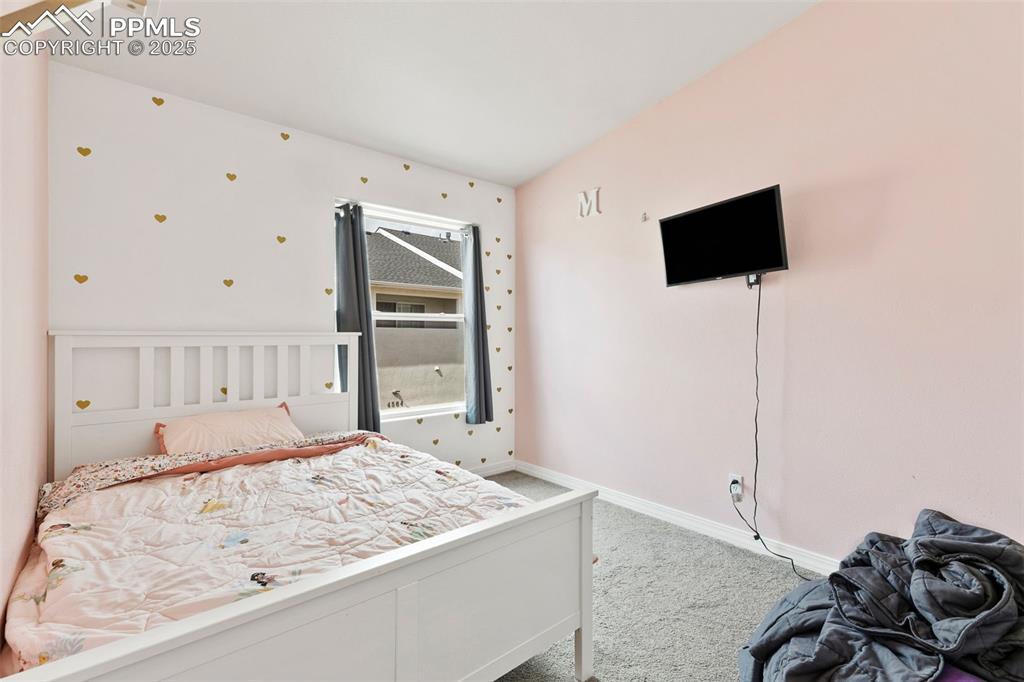 Image 22 of 29: Bedroom featuring carpet and baseboards