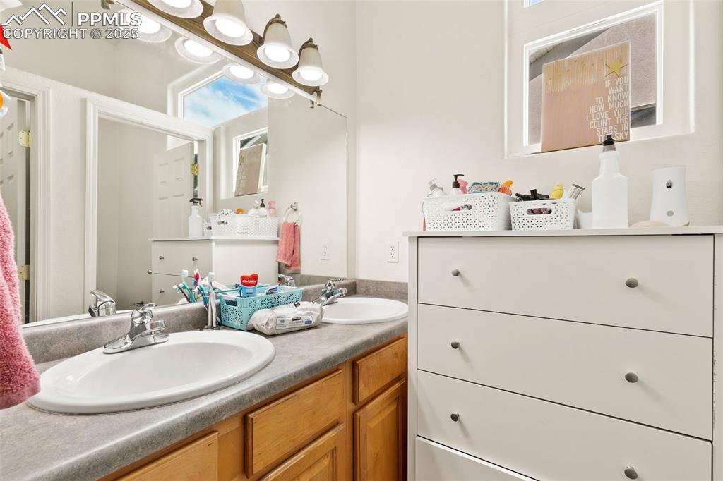 Image 26 of 29: Bathroom with double vanity
