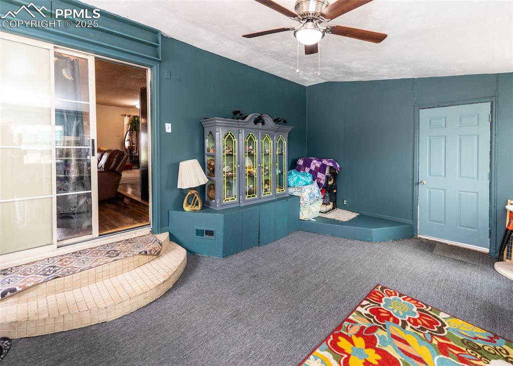 Image 29 of 42: Rec room with carpet flooring and ceiling fan