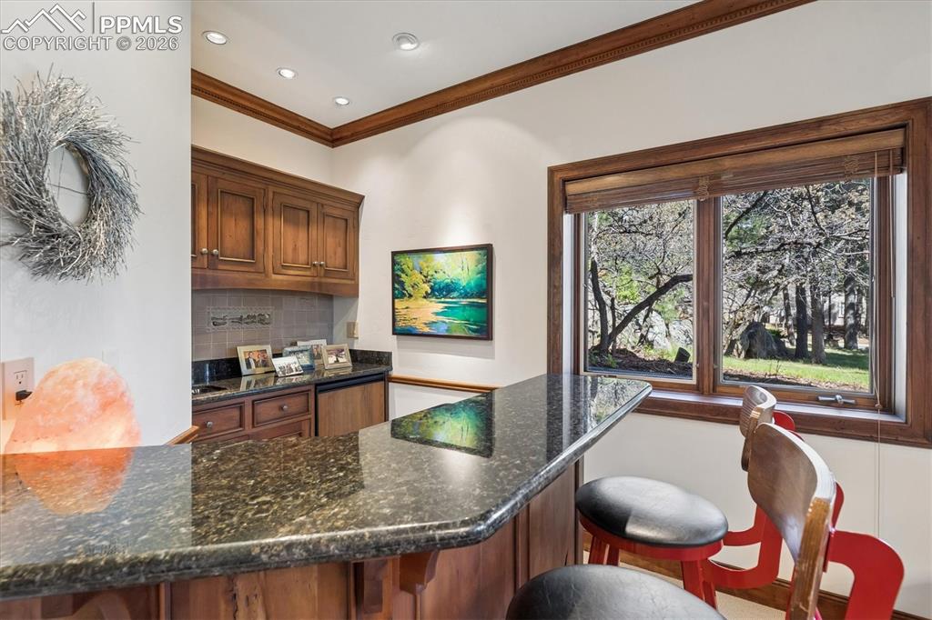 Image 25 of 47: Lower level wet bar