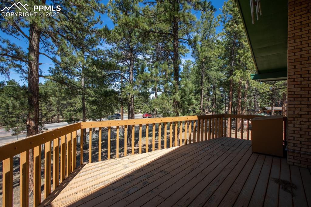 Image 14 of 36: Deck adjoining main level dining room