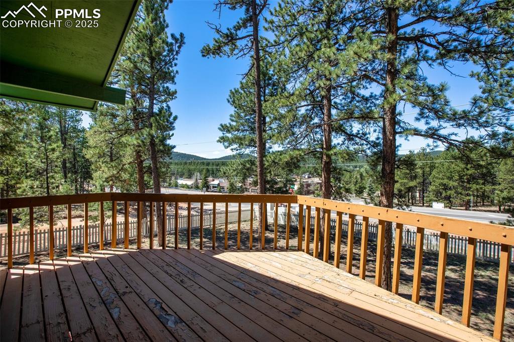 Image 15 of 36: Wooden deck with a mountain view