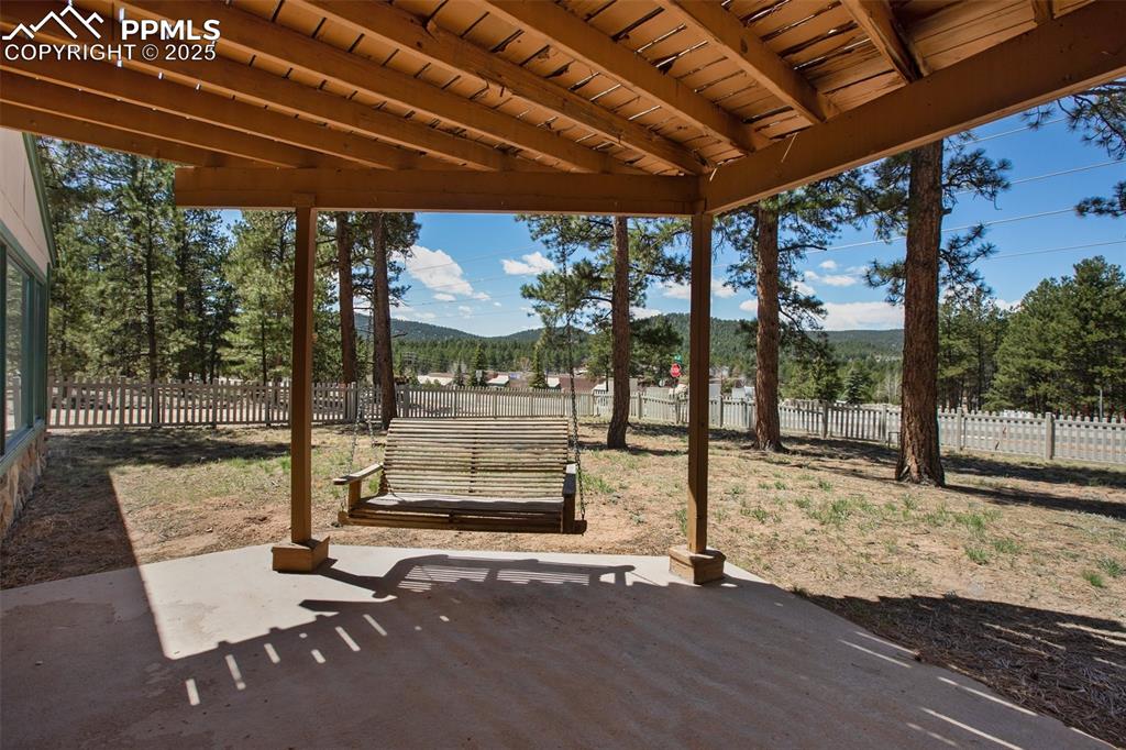 Image 29 of 36: Walk out patio on lower level off of family room