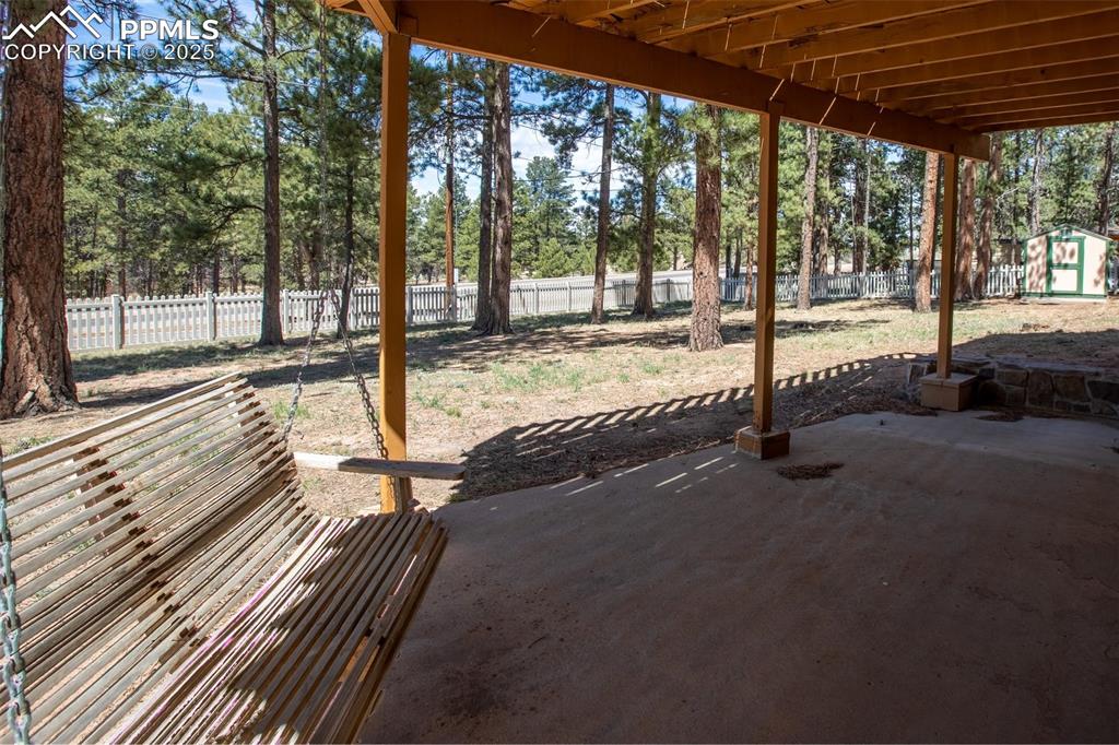 Image 30 of 36: View of patio featuring a fenced backyard
