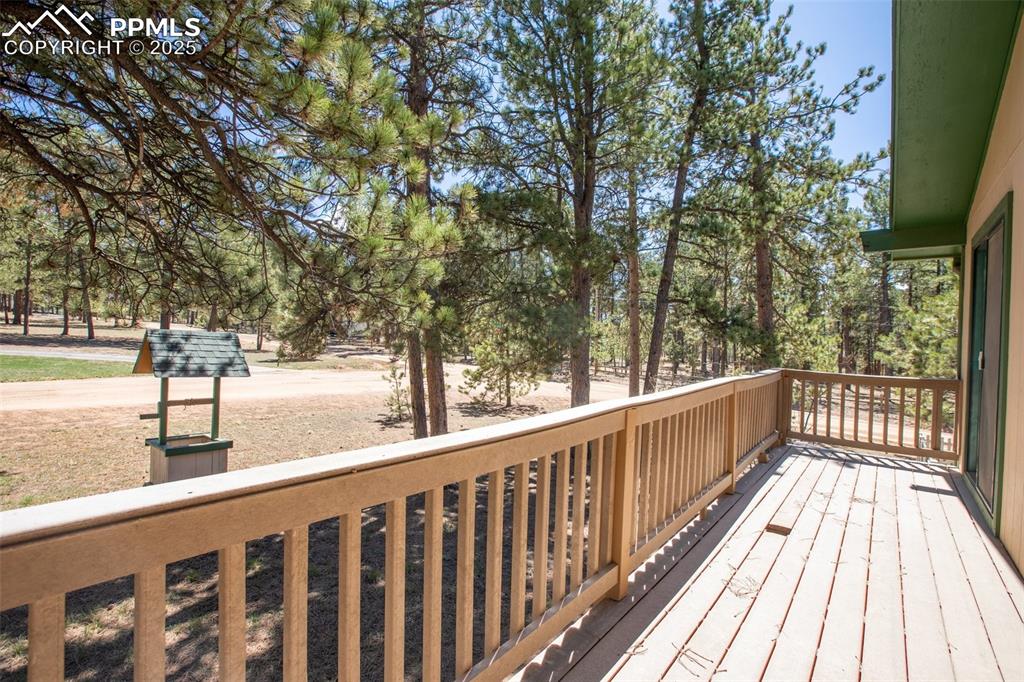 Image 35 of 36: Deck on front of house accessed from primary bedroom