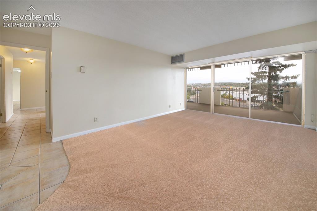 Image 10 of 33: Spacious Primary Bedroom with attached bath, walk-in closet and new carpet.