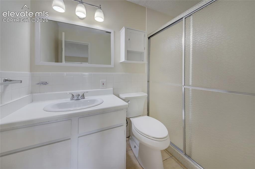 Image 12 of 33: Primary bath with large shower