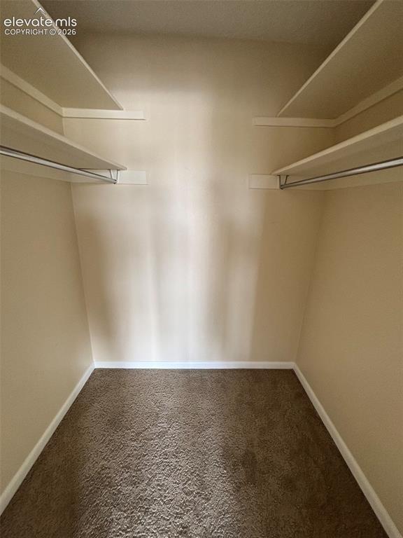 Image 14 of 24: Primary walk in closet