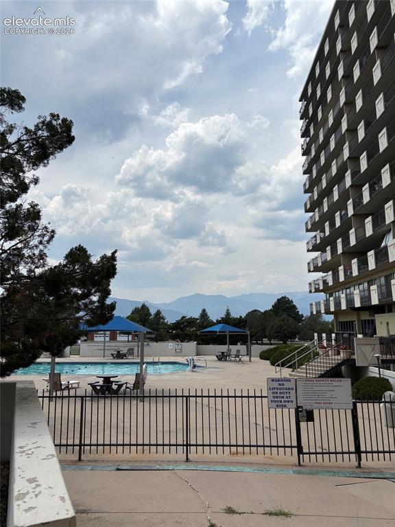 Image 18 of 24: Inviting pool with mountain views!