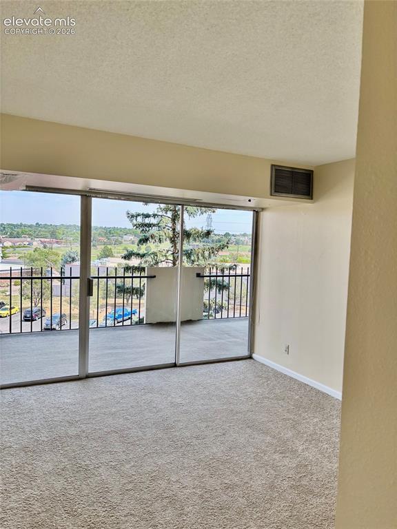 Image 4 of 24: View from the living room to the covered patio