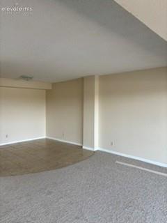 Image 7 of 24: Dining area with tiled floor