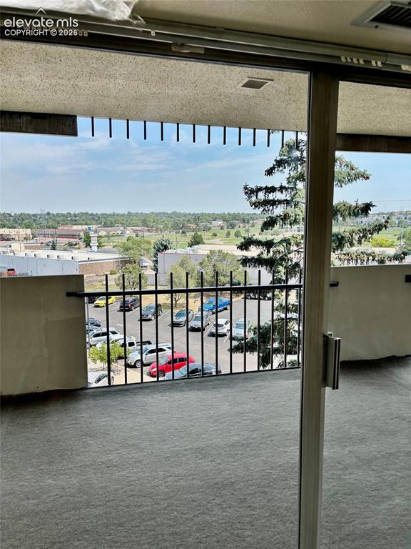 Image 9 of 24: Balcony view towards parking
