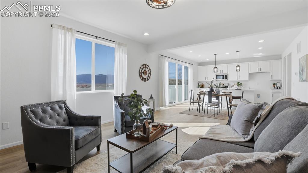 Image 13 of 45: View of the Great Room, Dining Area, and Kitchen.