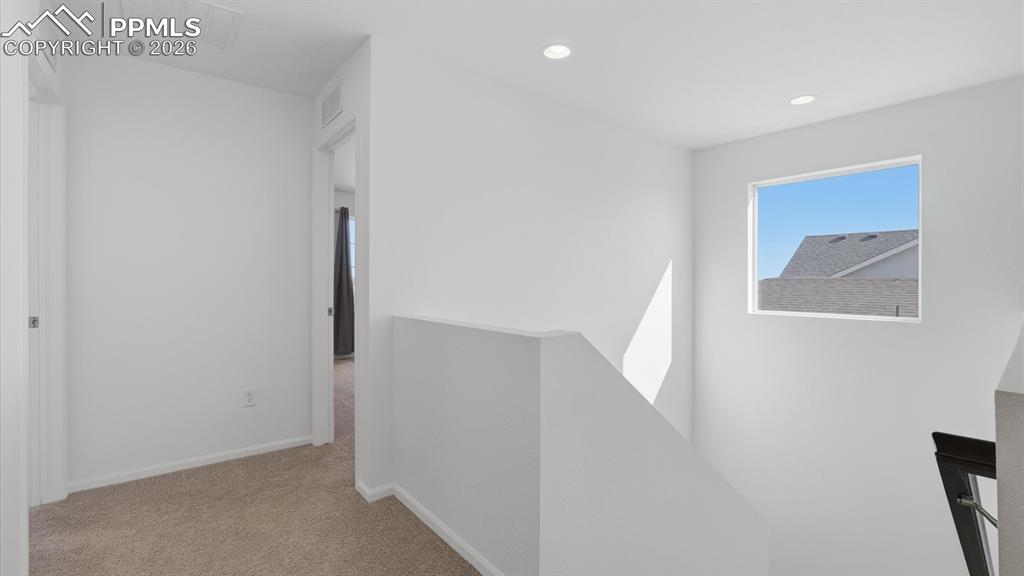 Image 38 of 45: Upper Level Landing and stairs to the main level.