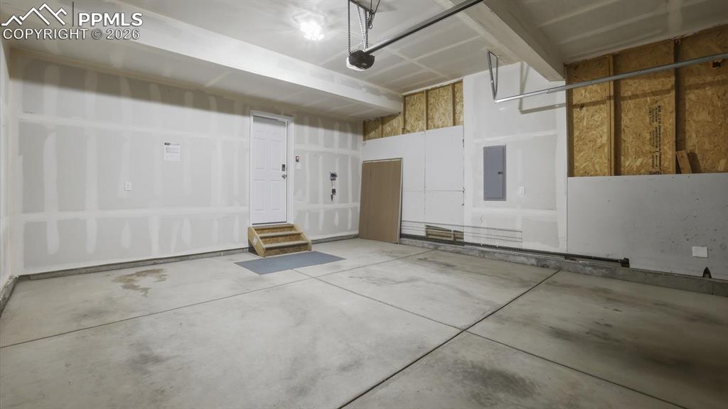 Image 39 of 45: 2-car attached garage with door opener.