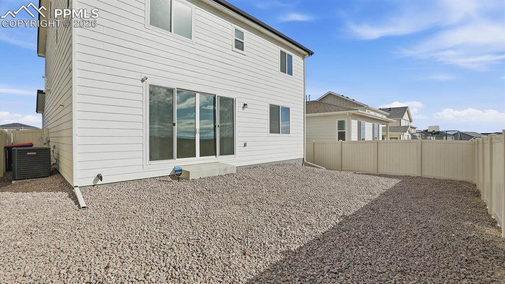 Image 41 of 45: Fenced backyard ready for your personal touches to build your own backyard