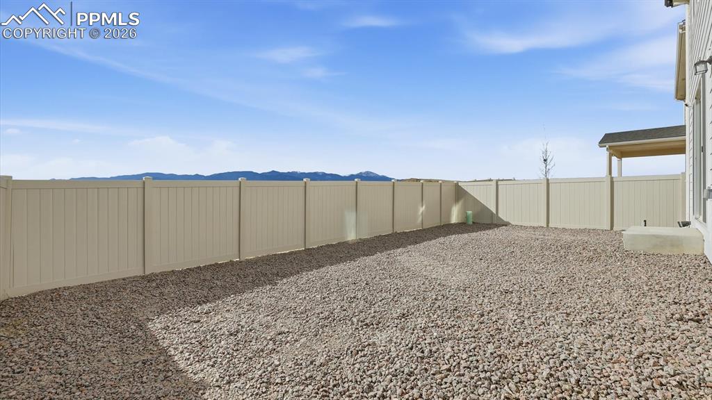 Image 43 of 45: Fenced level backyard.