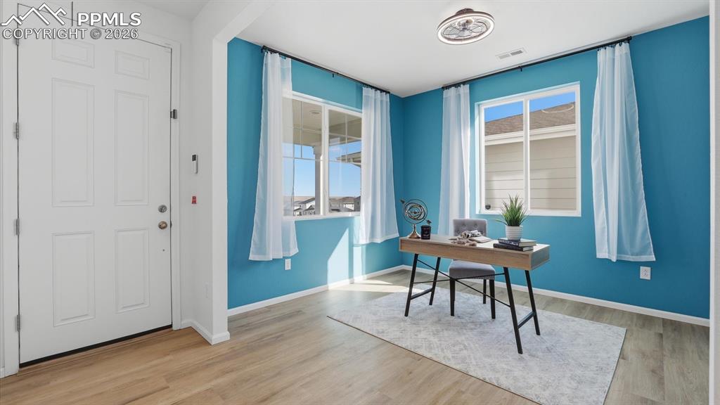 Image 6 of 45: Upon entry, you’re welcomed by a versatile home office or sitting area wit