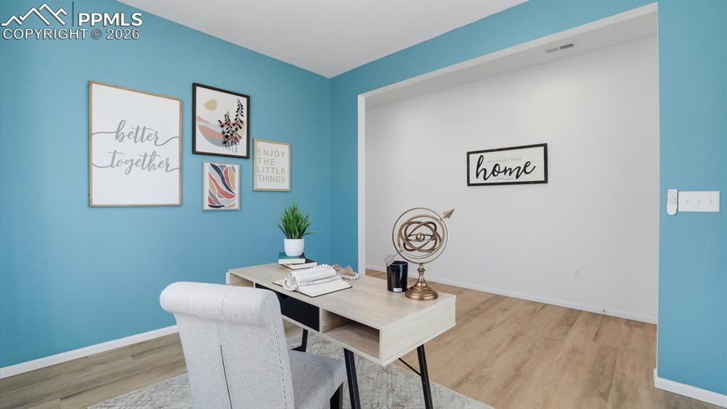 Image 7 of 45: View of the entry hallway from the office.