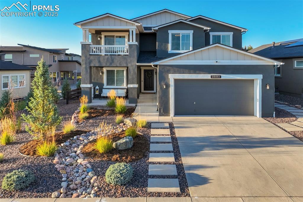 Caption: New stucco exterior with a 3 car tandem garage.