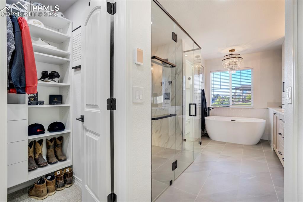 Image 19 of 50: Dual closets before entering the custom Primary Bathroom. 