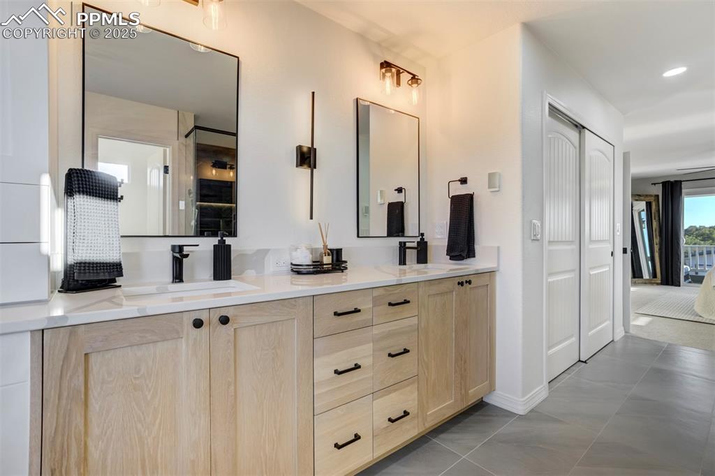 Image 20 of 50: No detail was left untouched from the heated tile flooring to the custom li