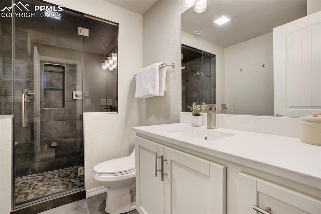 Image 35 of 50: Beautiful bathroom in the basement. 