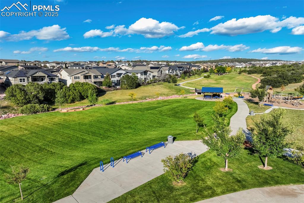 Image 44 of 50: The park and paved walking path is a short walk from the home. 