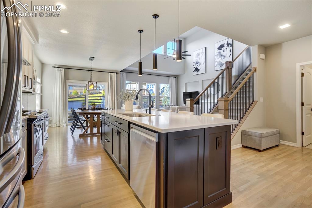 Image 8 of 50: Oak hardwood floors throughout the main level. 